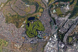 A satellite view of Oahuʻs Salt Lake, showing a golf course, surrounding neighborhoods, and the slope of nearby mountains
