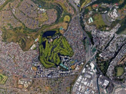 A satellite view of Oahuʻs Salt Lake, showing a golf course, surrounding neighborhoods, and the slope of nearby mountains