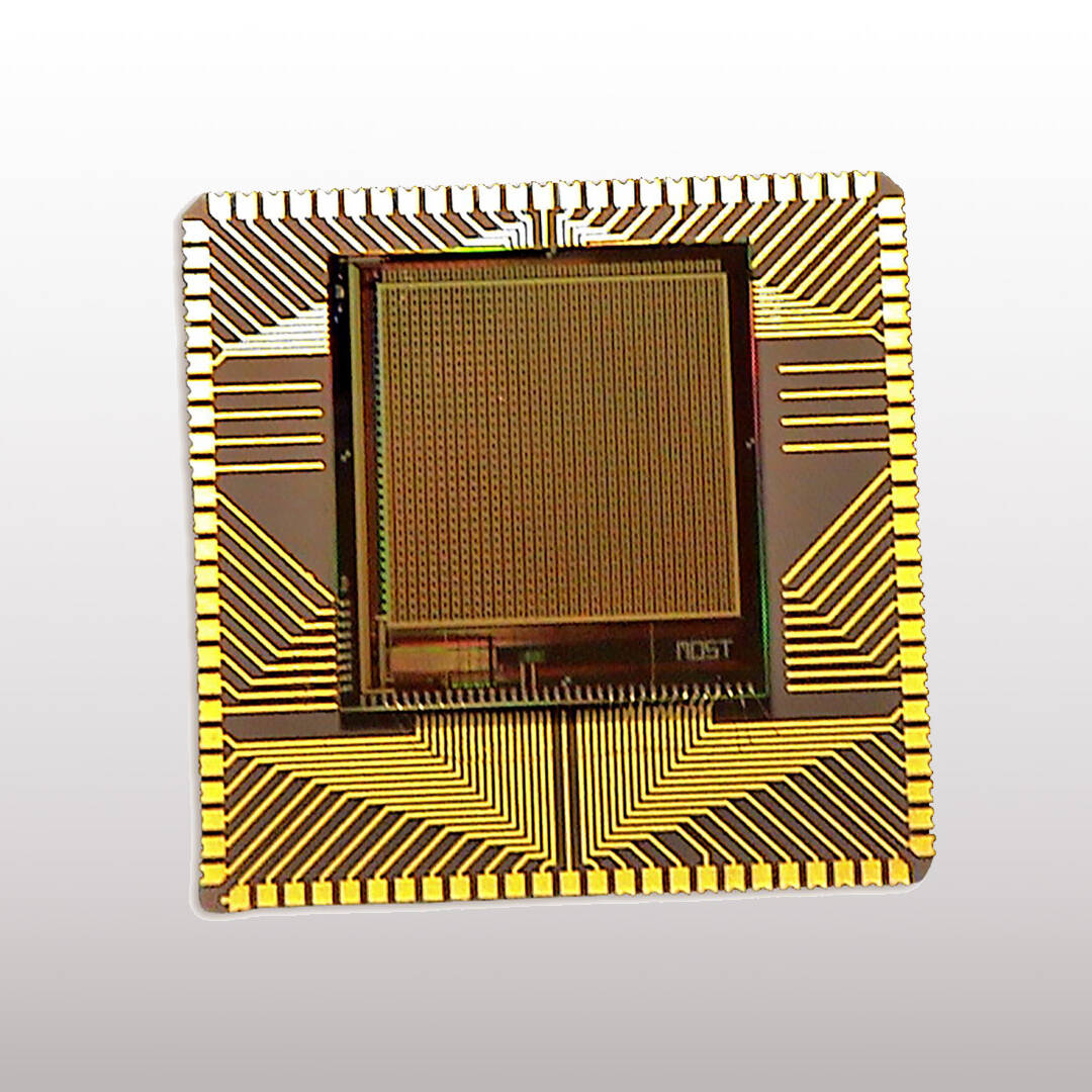 A gold colored computer chip on a white background