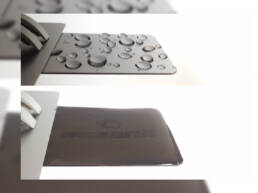 Two metal coupons, one with droplets of water and one with an even coating of water.