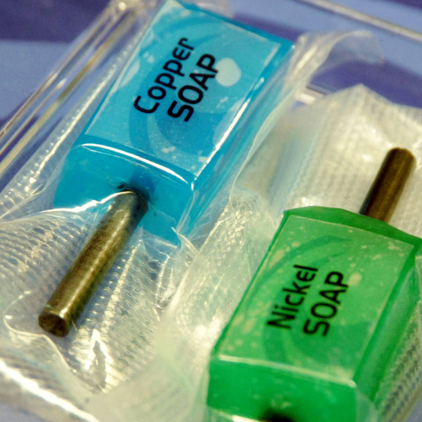 A blue substance labeled Copper SOAP and a green substance labeled Nickel SOAP