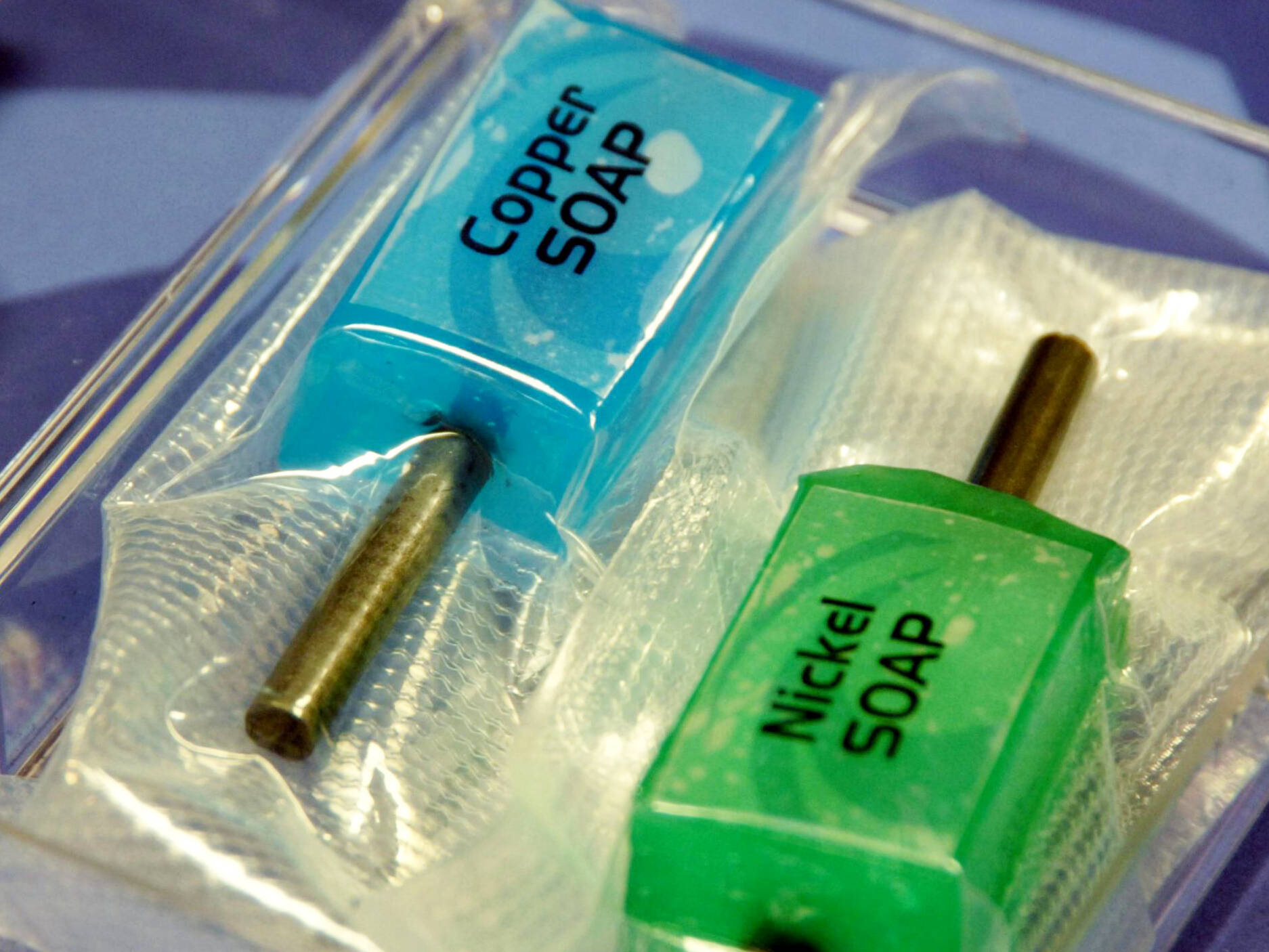 A blue substance labeled Copper SOAP and a green substance labeled Nickel SOAP