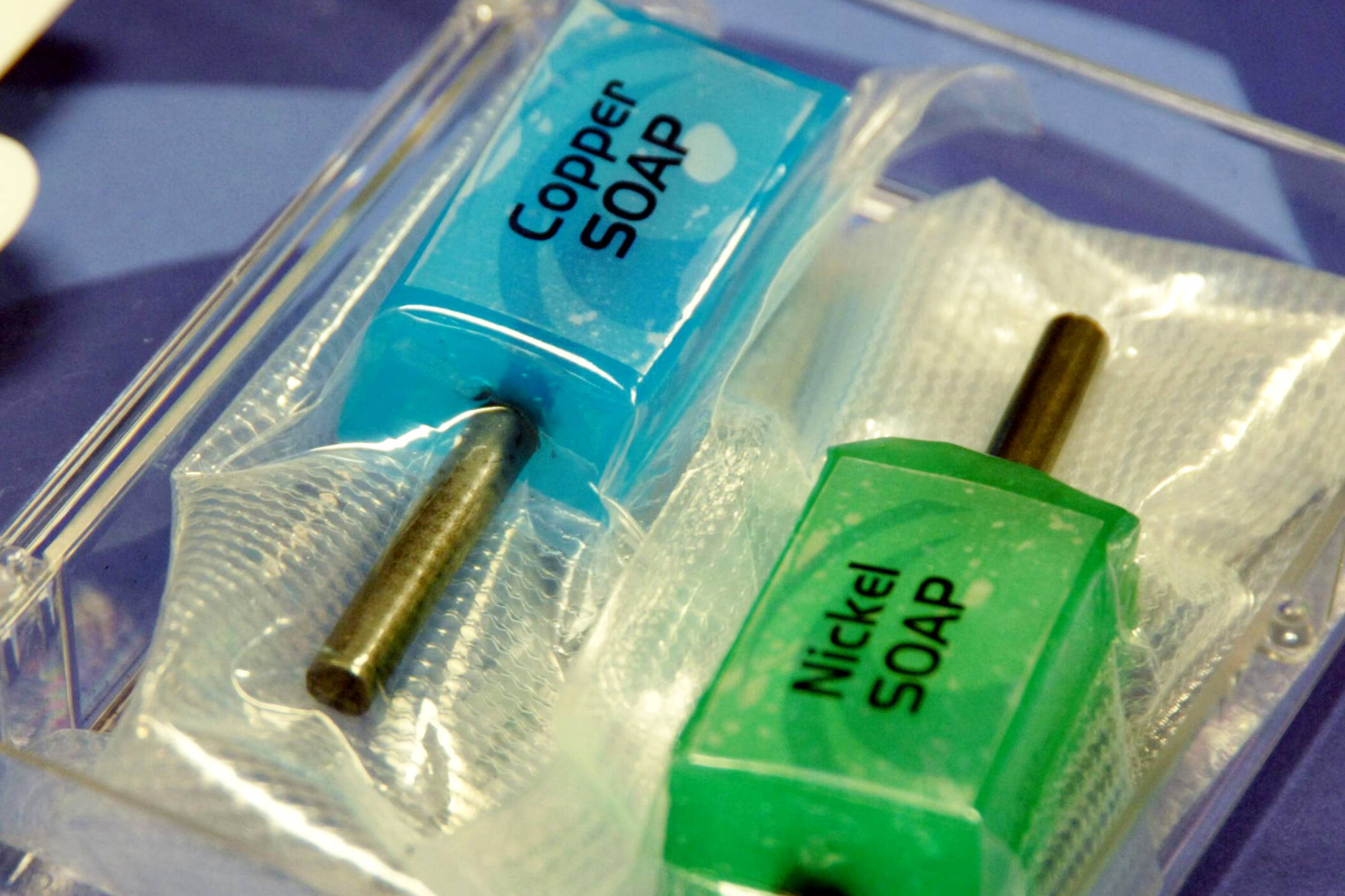 A blue substance labeled Copper SOAP and a green substance labeled Nickel SOAP