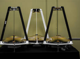 Three MAMBA atmospheric sensors lined up in a room