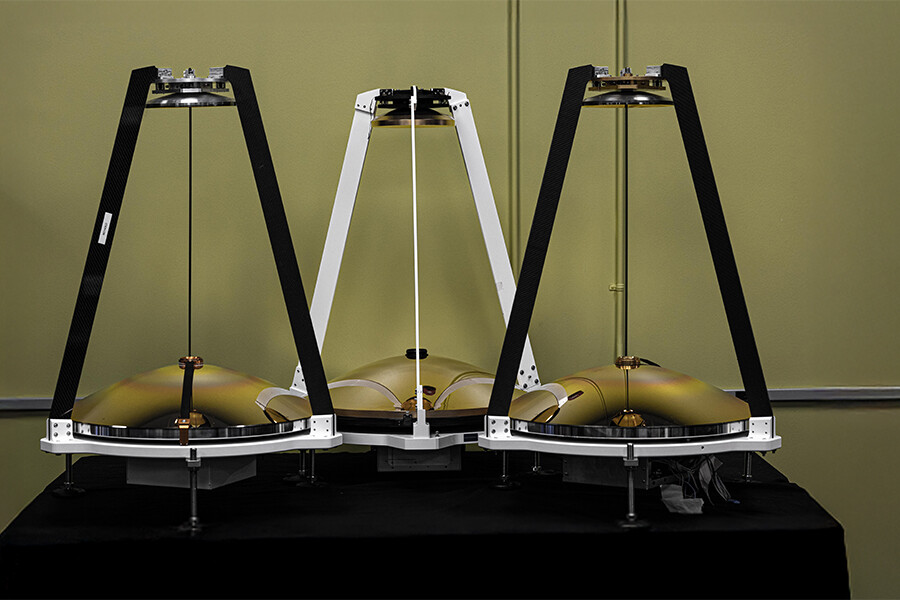 Three MAMBA atmospheric sensors lined up in a room