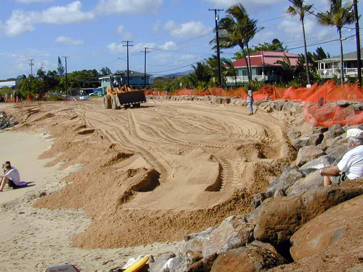 A fenced-off beach undergoing sand fortification