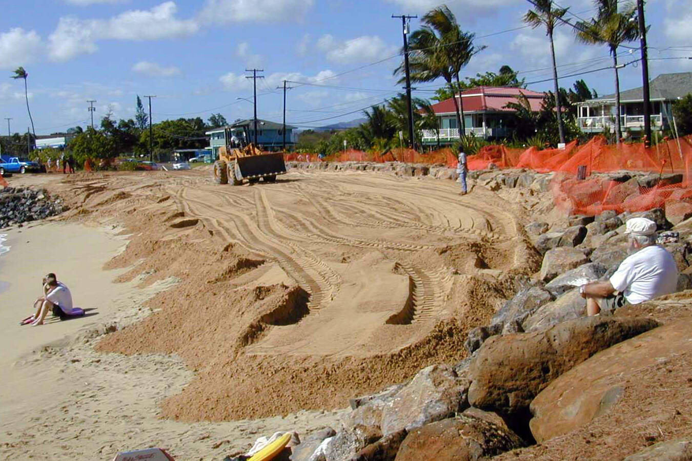 A fenced-off beach undergoing sand fortification