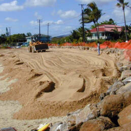 A fenced-off beach undergoing sand fortification