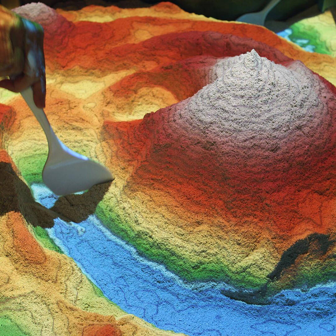 A scale model of a landscape, projected from above on a 3D surface