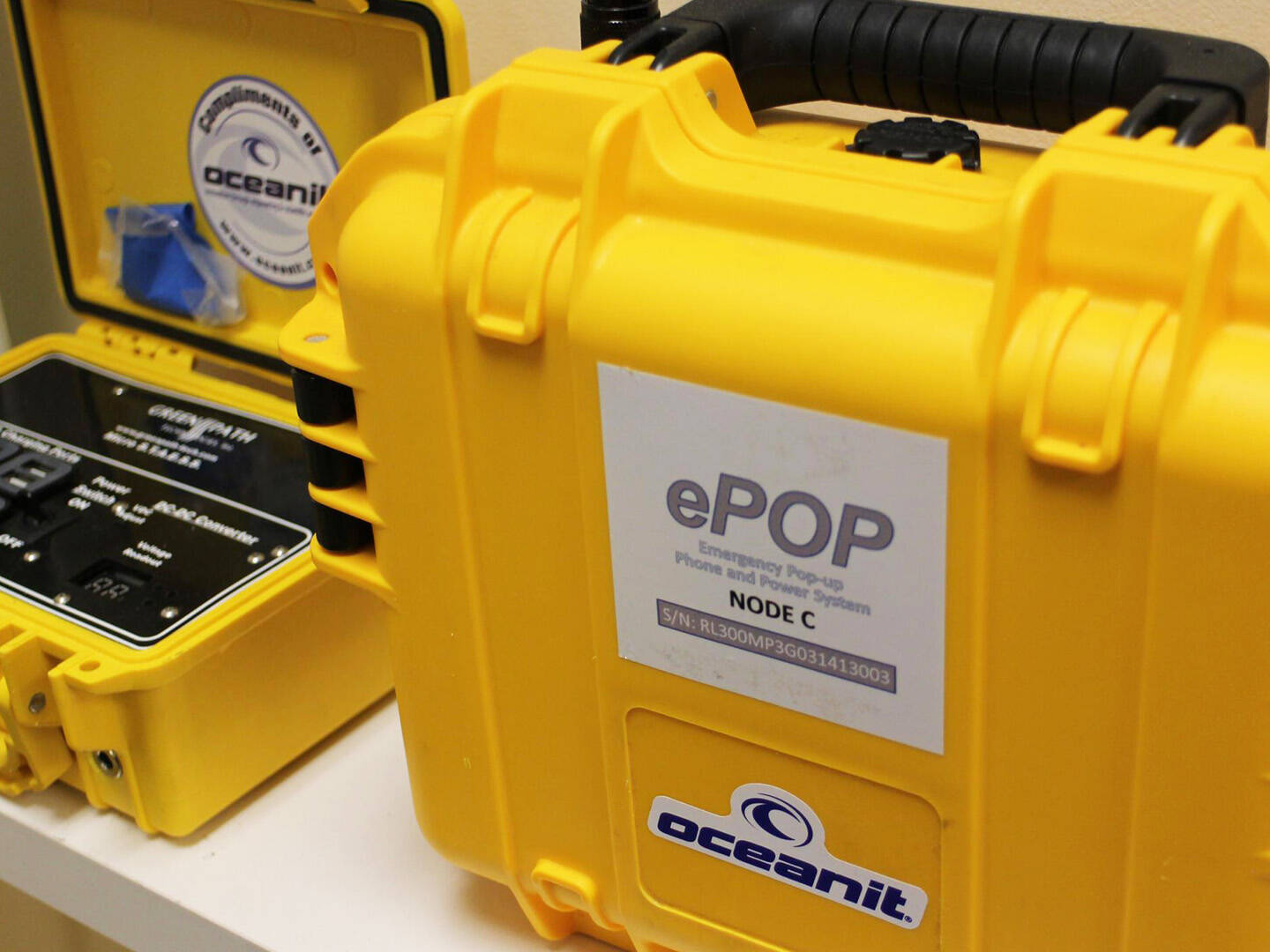 A yellow hard shell case with an ePOP label