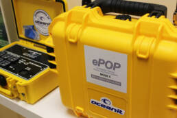 A yellow hard shell case with an ePOP label