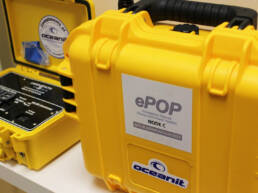 A yellow hard shell case with an ePOP label