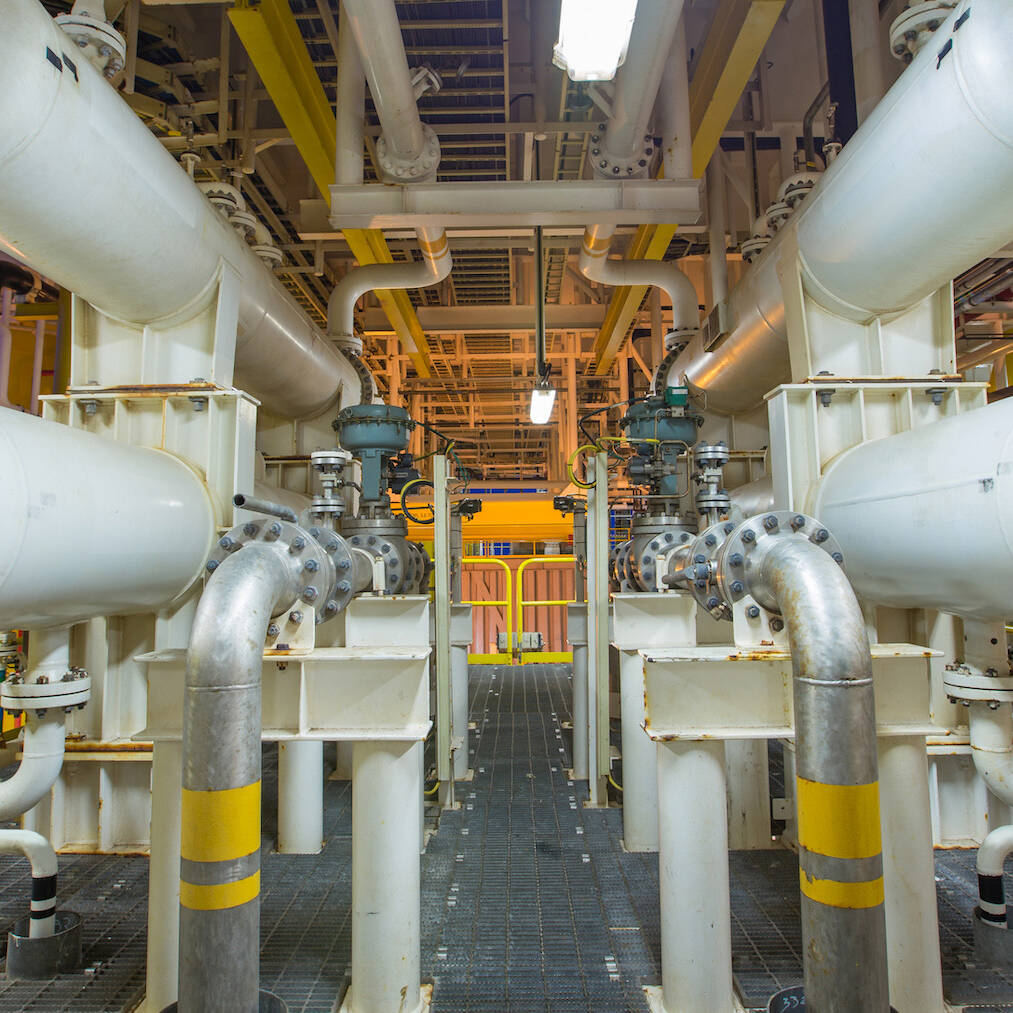 The interior of an energy warehouse with pipes running through the structure