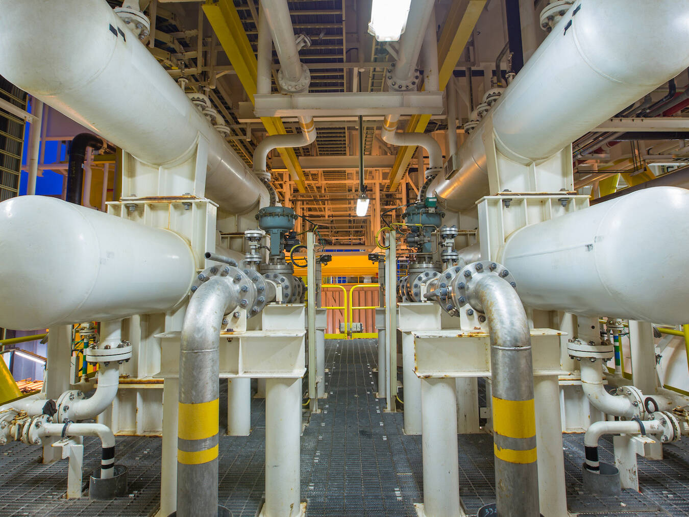 The interior of an energy warehouse with pipes running through the structure