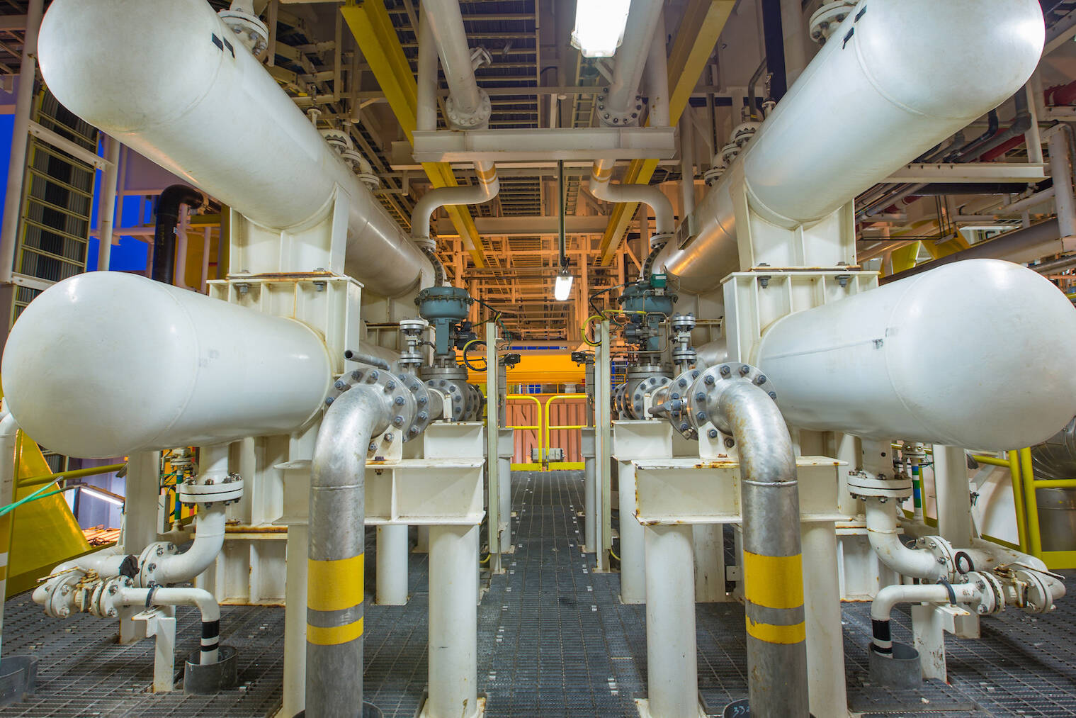 The interior of an energy warehouse with pipes running through the structure