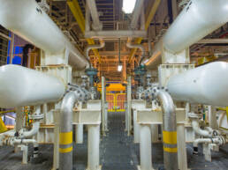 The interior of an energy warehouse with pipes running through the structure