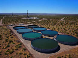 An aerial view of eight large water reservoirs