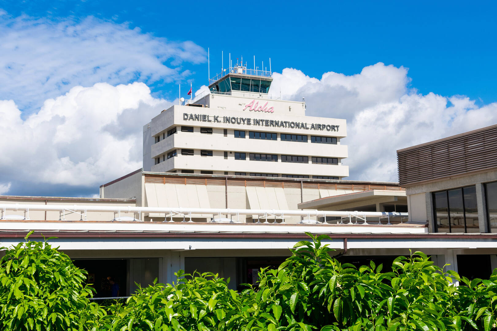 A white air traffic control tower with the words