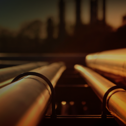 Pipelines glowing orange in the sunset
