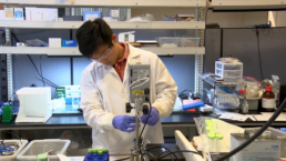 A student intern using machinery in the oceanit lab