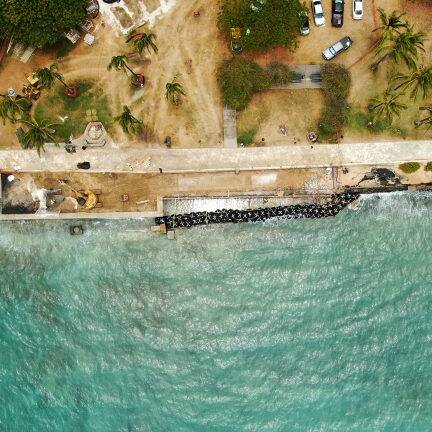 A top-down view of a shoreline reinforced for erosion mitigation