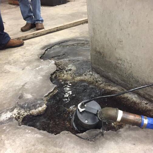 A cracked concrete floor in the HNL basement