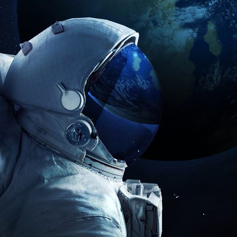 An astronaut wearing a space suit in profile