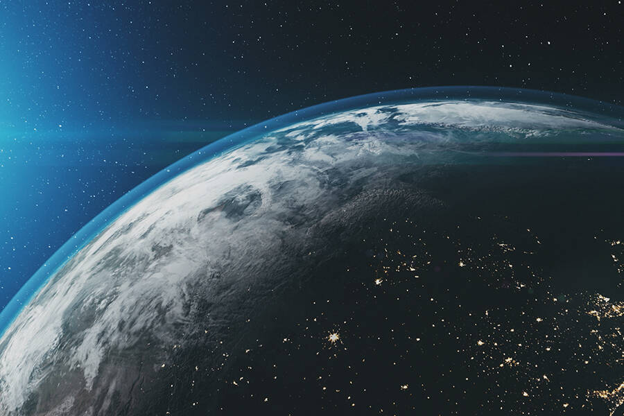 Earth and its atmosphere, with the sun in the background