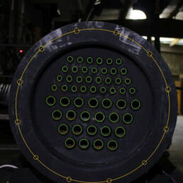 A heat exchanger front, with the ports outlined in green