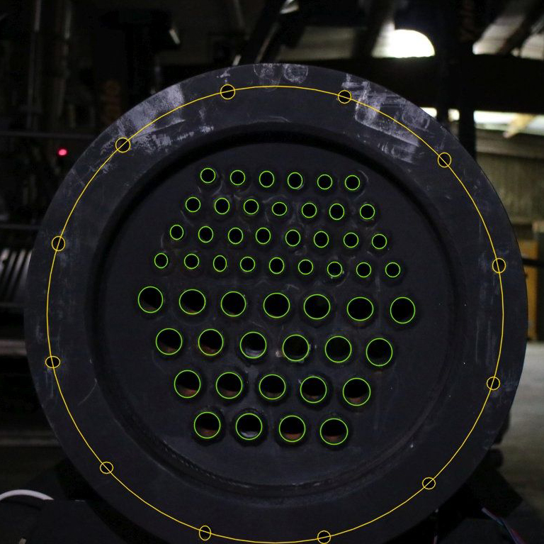 A heat exchanger front, with the ports outlined in green