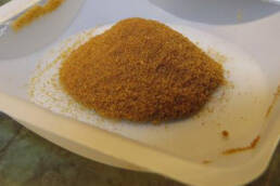 A tray of DERT powder in a pile on a white tray