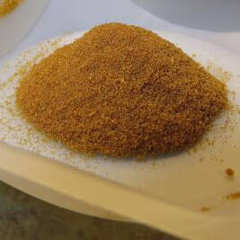 A tray of DERT powder in a pile on a white tray