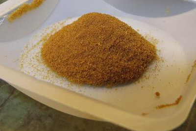 A tray of DERT powder in a pile on a white tray