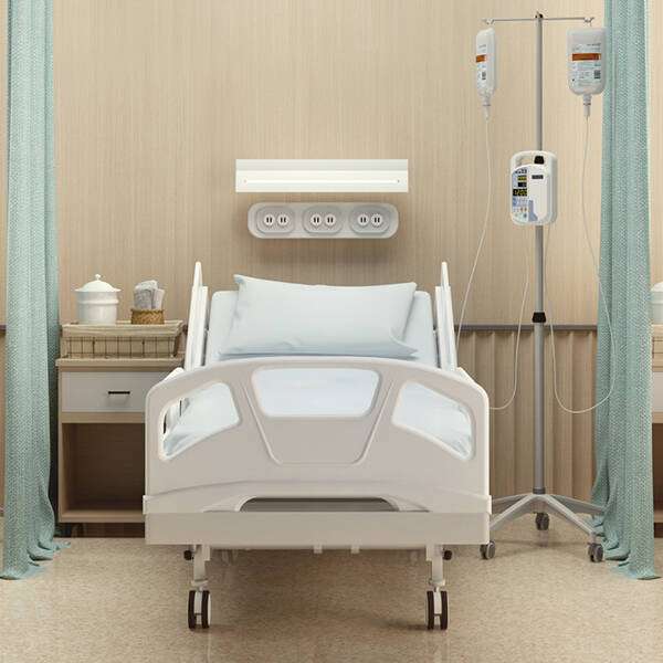 A hospital room with three symmetrical hospital beds and curtains separating them