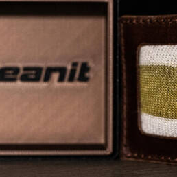 A knitted swatch of KERTEX in a box labeled Oceanit