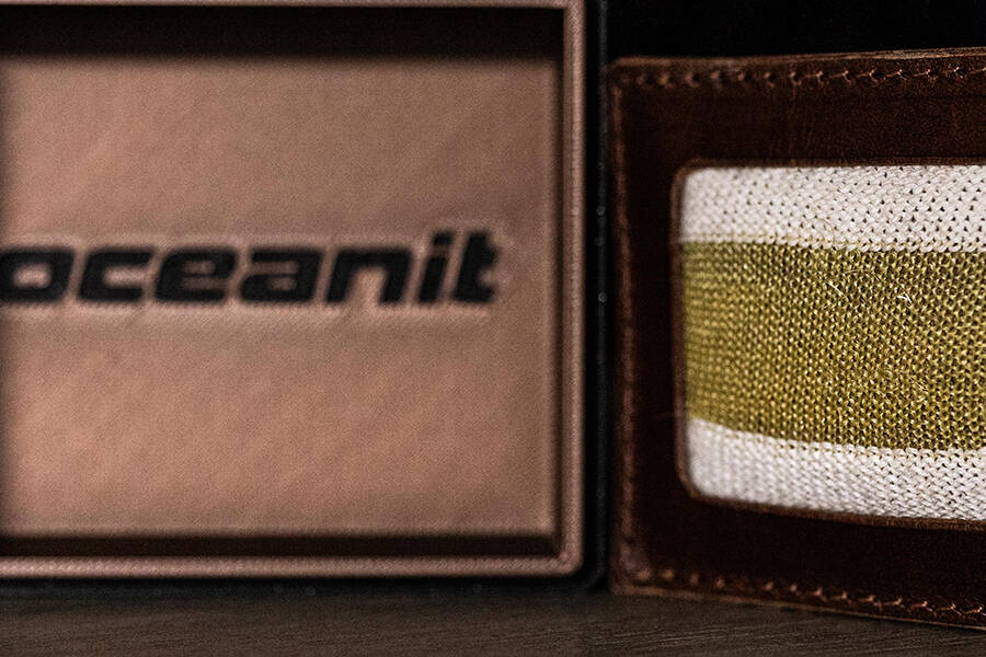A knitted swatch of KERTEX in a box labeled Oceanit