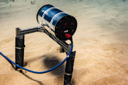 An underwater photo of an ULTRA sensor on the sea floor