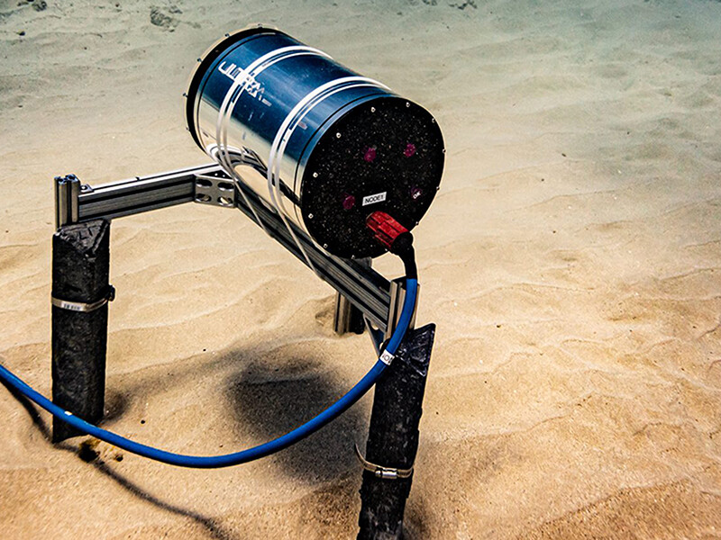 An underwater photo of an ULTRA sensor on the sea floor