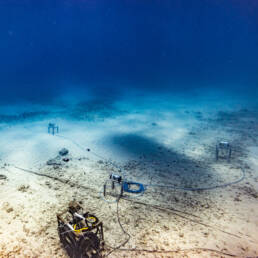 Underwater sensors connected by cables on the sea floor