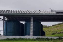 The DHHL Kahikinui site, a small open building containing reservoirs