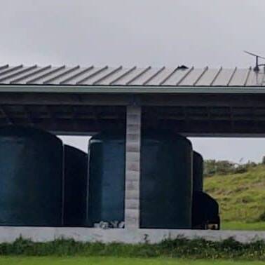 The DHHL Kahikinui site, a small open building containing reservoirs