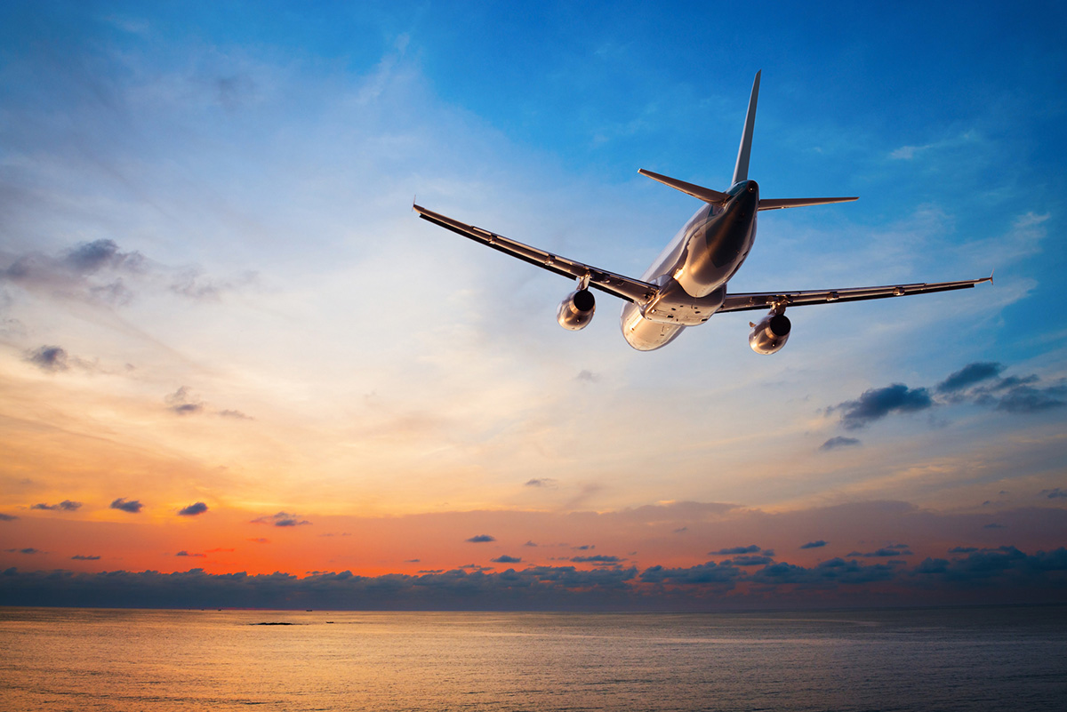 A Boeing 737 flying into the sunset